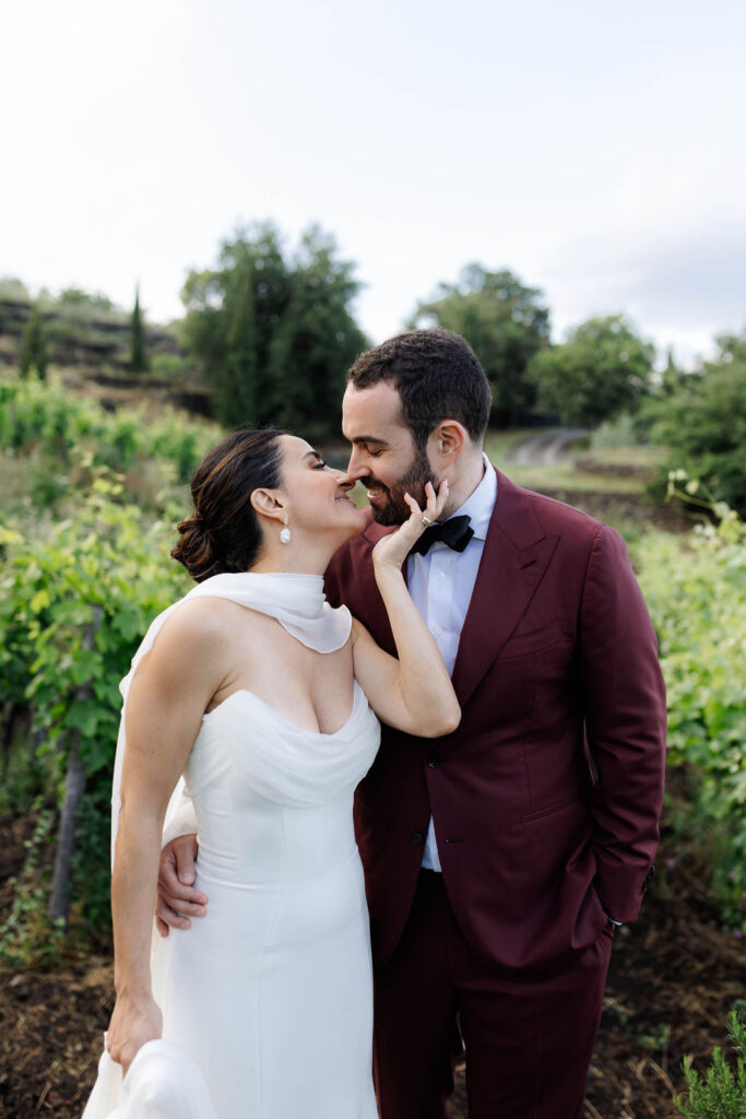 Bride and groom portraits surrounded by gardens at Monaci delle Terre Nere Sicily Italy