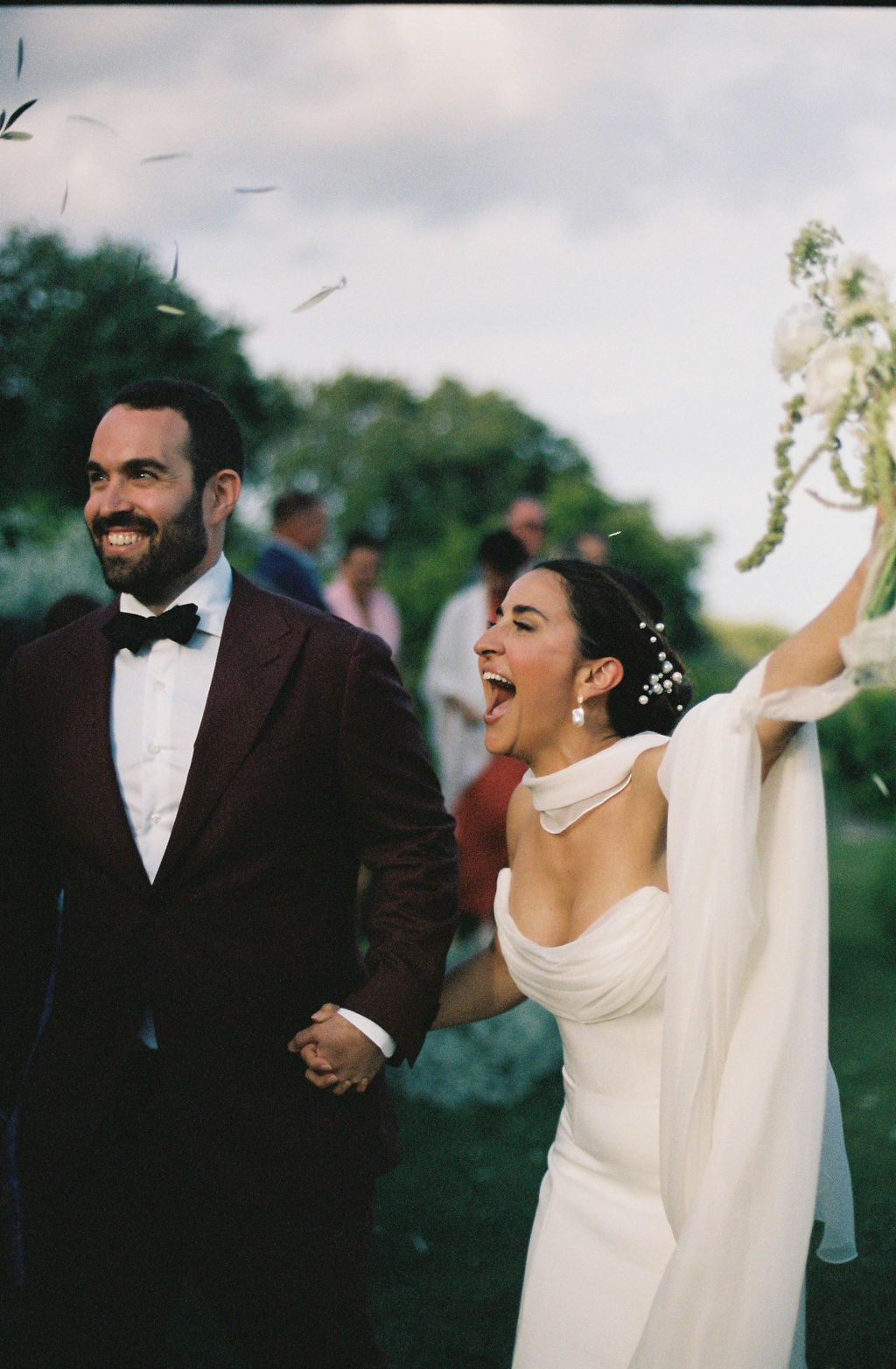 Bride and groom cheering at their at Monaci Delle Terre Nere wedding in Siciliy, Italy